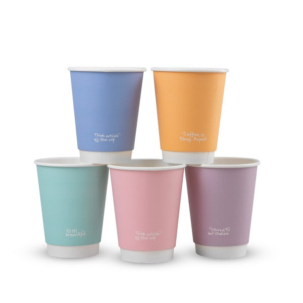 Set of six colorful paper cups with text on a white background
