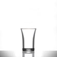 Clear shot glass on a white background