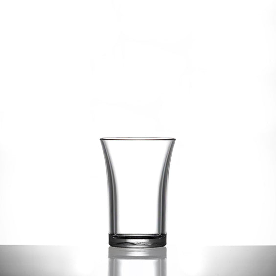 Clear shot glass on a white background