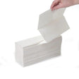 Hand pulling a white paper towel from a box on a white background