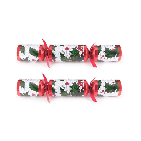 Two Christmas crackers with holly design on a white background