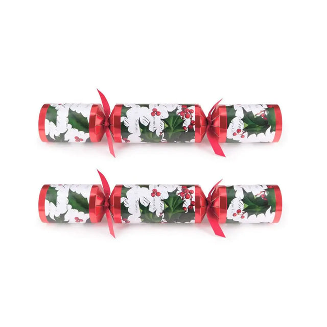 Two Christmas crackers with holly design on a white background