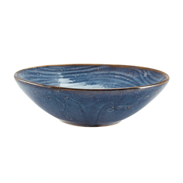 Aqua Blue organic shaped porcelain bowl with a rolled edge and unique glaze, on a plain background.