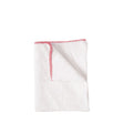 White cloth with red trim on a white background