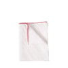 White cloth with red trim on a white background