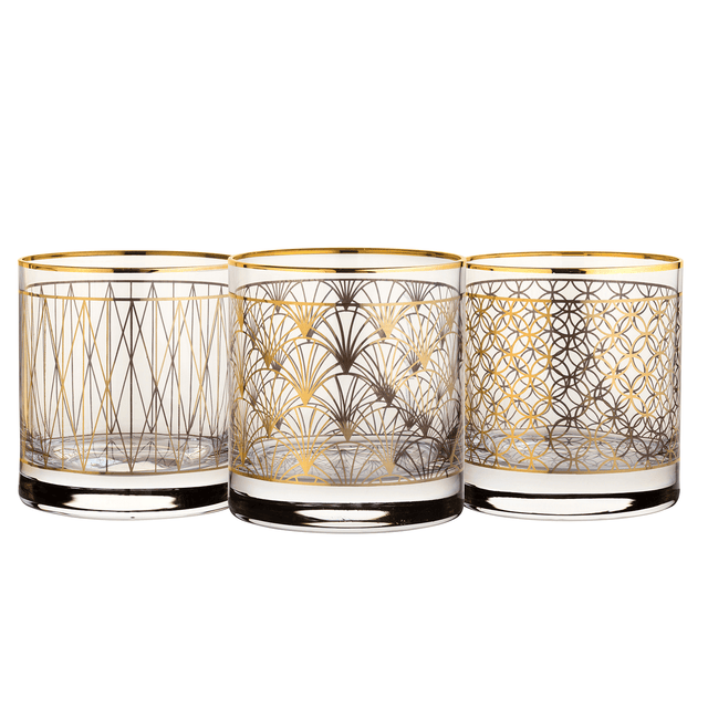Three decorative glasses with gold geometric patterns on a white background