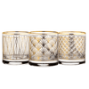 Three decorative glasses with gold geometric patterns on a white background