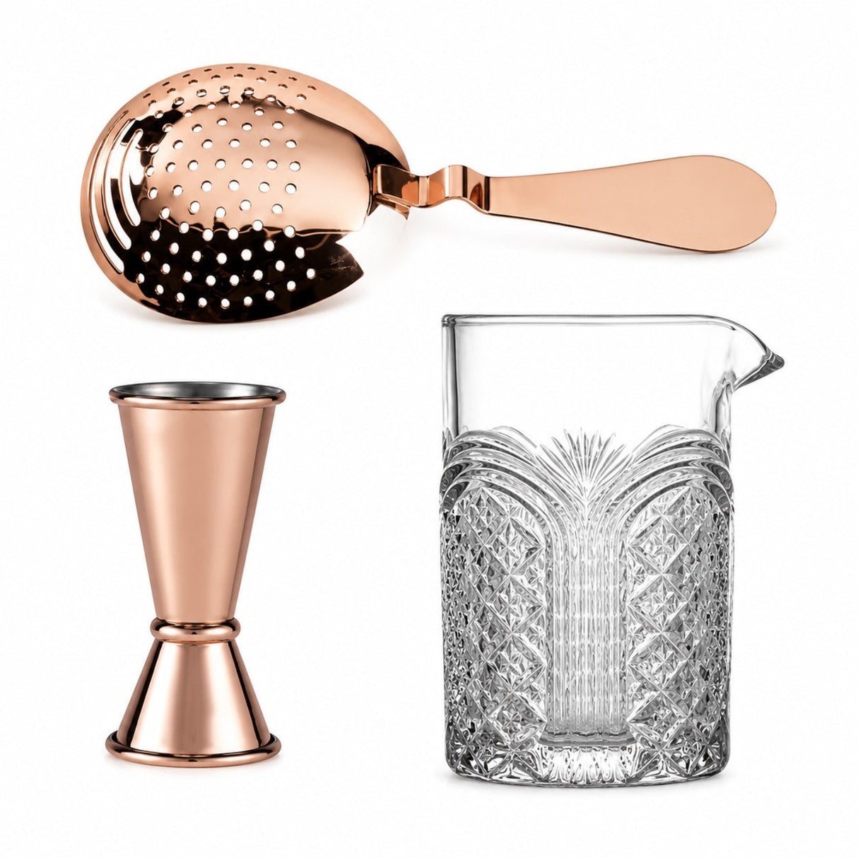 copper jigger along with copper julep strainer and astro mixing glass on a white background 