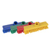 Four colorful brushes with scrubbing pads on a white background