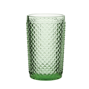 Green textured glass tumbler on a white background