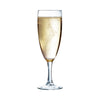 A clear sodalime glass flute with a sparkling beaded rim, filled with a golden-yellow liquid, presumably champagne.