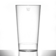 An empty clear polycarbonate drinking glass with a UKCA pint brim measurement marking.