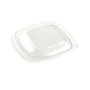 Clear plastic food container lid on a white background