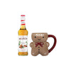 Monin gingerbread syrup bottle and gingerbread mug on a white background