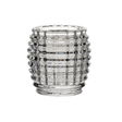 Clear glass candle holder with textured design on a white background