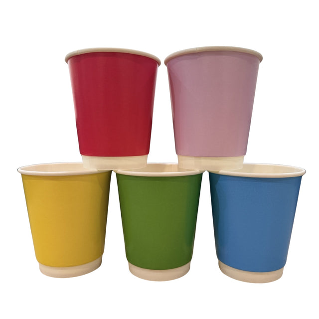 Four paper cups in red, pink, yellow, green, and blue, arranged in a pyramid stack on a white background.