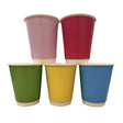 Five paper cups in different colors arranged in two rows on a plain white background: two mauve and red cups in the back, and one green, one yellow, and one blue cup in the front.
