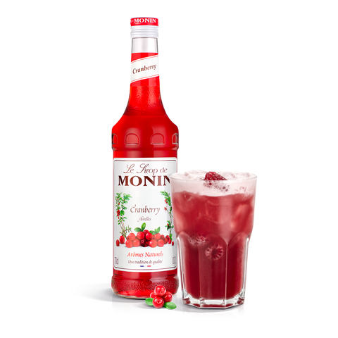 Monin Cranberry Syrup bottle and a fruity drink