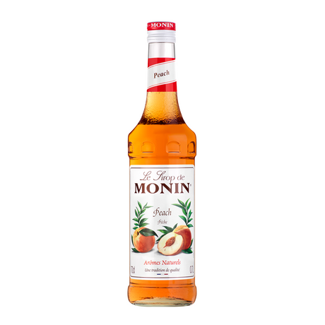 Monin Peach syrup bottle on a white background