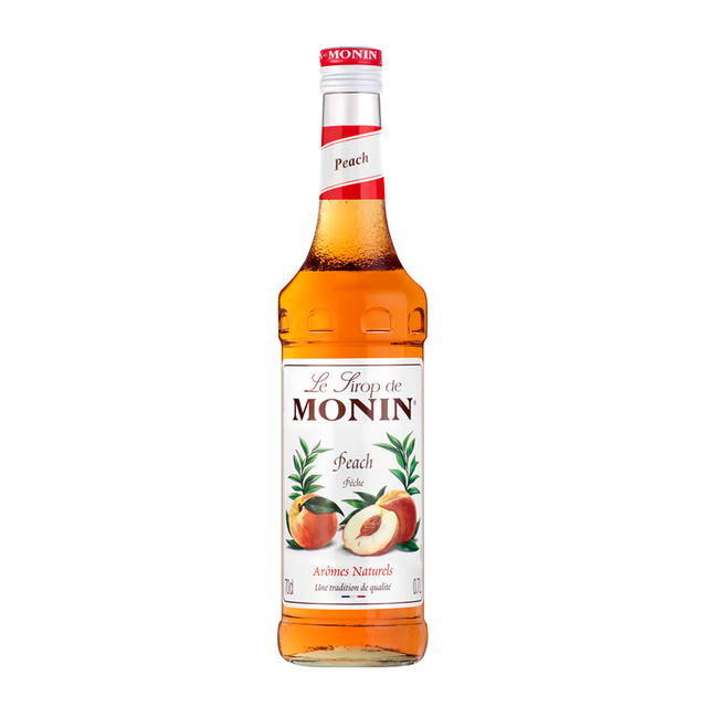 Monin Peach syrup bottle on a white background