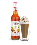 Monin Pumpkin Spice syrup bottle and a coffee