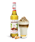 Monin Roasted Hazelnut Syrup bottle and creamy drink