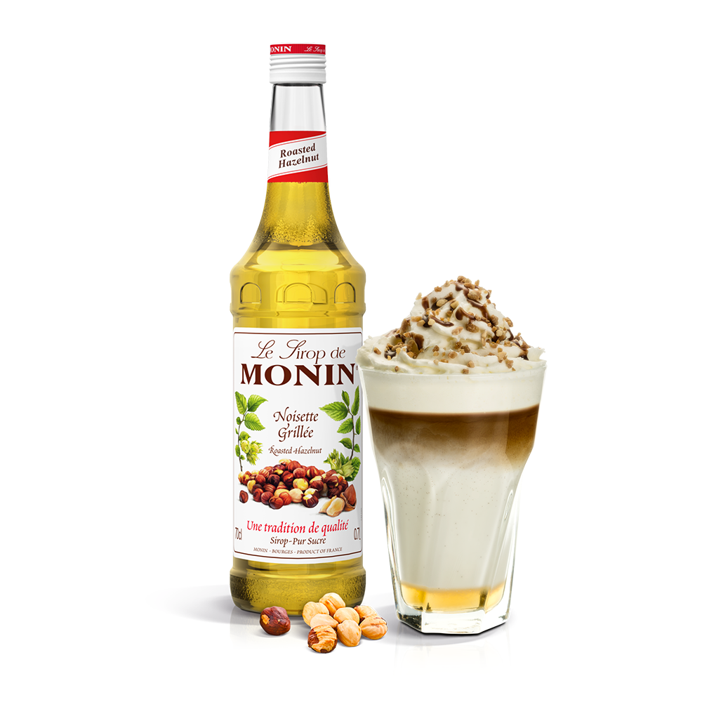 Monin Roasted Hazelnut Syrup bottle and creamy drink