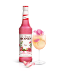 Monin Rose Syrup bottle and a cocktail