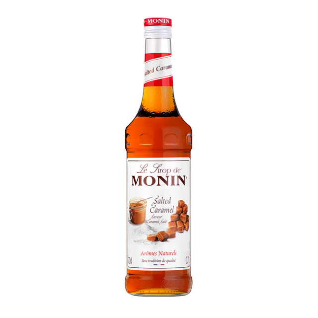 Bottle of Monin Salted Caramel syrup on a white background