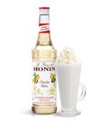 Monin White Chocolate Syrup bottle and a creamy drink