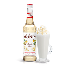 Monin White Chocolate Syrup bottle and a creamy drink