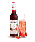 Monin Wild Strawberry Syrup bottle and a strawberry drink