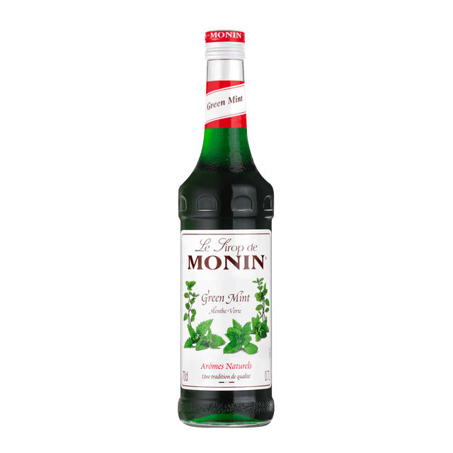 A 700ml glass bottle of Monin Mint (Green) Syrup with a label showing the brand name, product name, and an image of mint leaves.