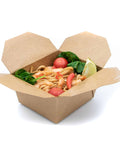 Takeout container with noodles and vegetables on a white background