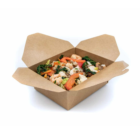 Cardboard takeout container with a meal of shrimp, vegetables, and greens on a white background
