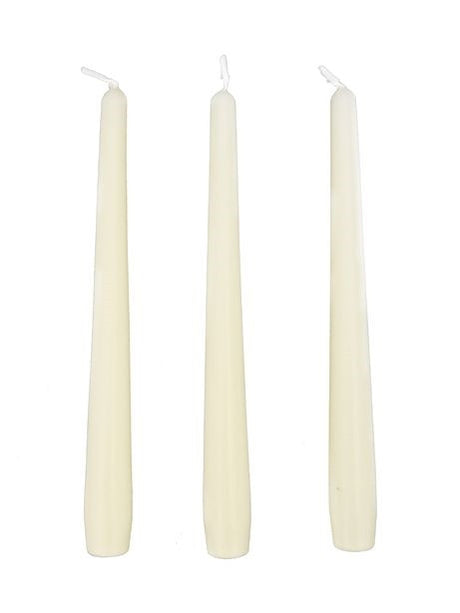 Three white candles of different sizes on a white background