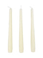 Three white candles of different sizes on a white background