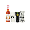 Monin syrup bottle with three decorative tiki mugs on a white background
