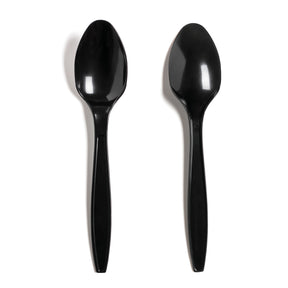 Two black disposable plastic spoons on a white background.