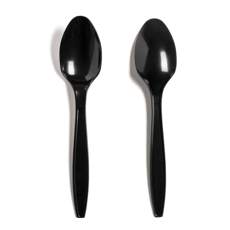 Two black disposable plastic spoons on a white background.