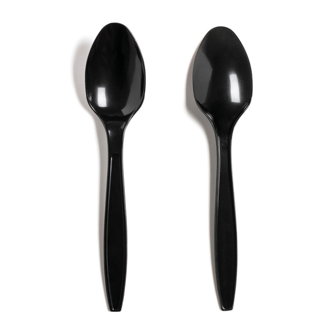 Two black disposable plastic spoons on a white background.