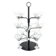 A black cocktail tree stand with multiple arms holding clear martini glasses, standing on a circular base.