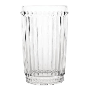 A clear glass tumbler with a geometric cut design.