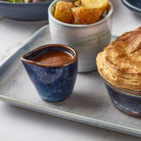 aqua blue terra porcelain jugl filled with gravy