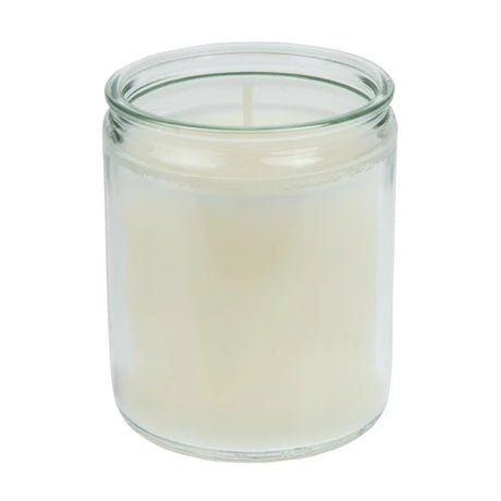 Clear glass candle jar with a white candle inside on a white background