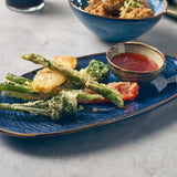 aqua blue terra porcelain organic shaped plate with b=vegetables and a bowl of dip 