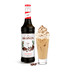 Monin coffe syrup with creamy drink in a tall glass