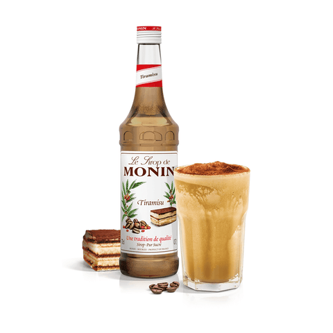 monin tiramisu syrup bottle beside a long drink