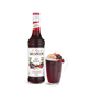 monin spiced red berry syrup bottle and drink