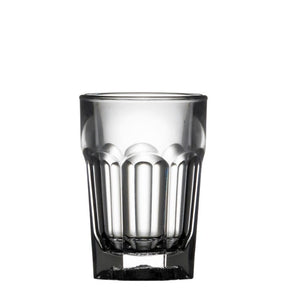 Clear plastic shot glass with vertical ridges on a white background